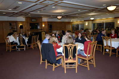 The crowd enjoys food and conversation