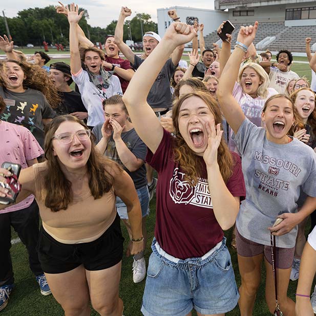 Happy Missouri State students on the ball field. 