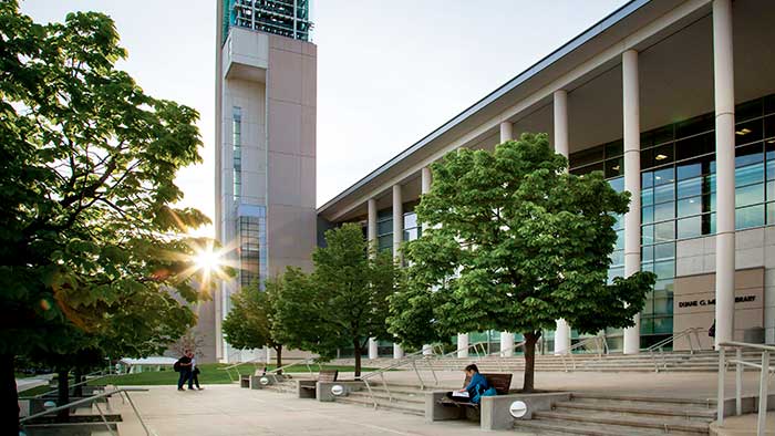 Students in front of Meyer Library at sunset