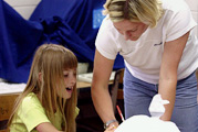 Education student teaching a child