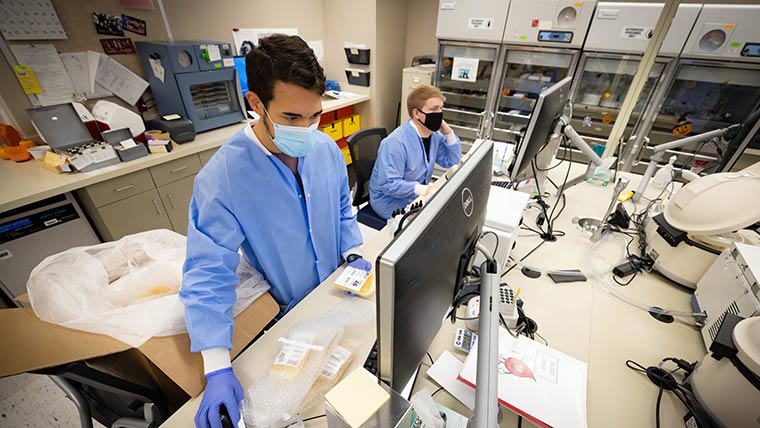Clinical lab students using computers at Cox South hospital.