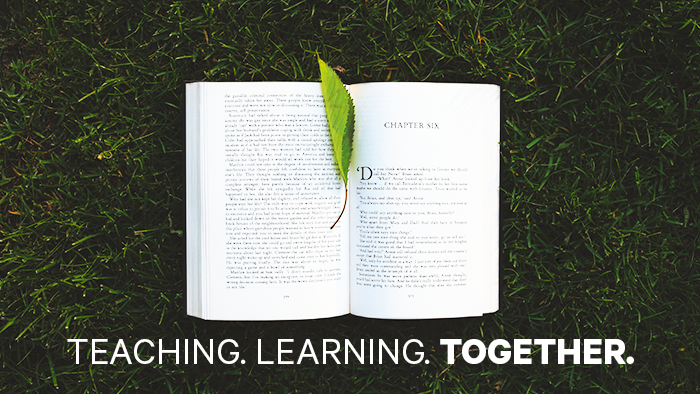 A book sits open in the grass, caption: "Teaching. Learning. Together"