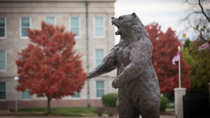 Fall campus scene with one of MSU's bear statues