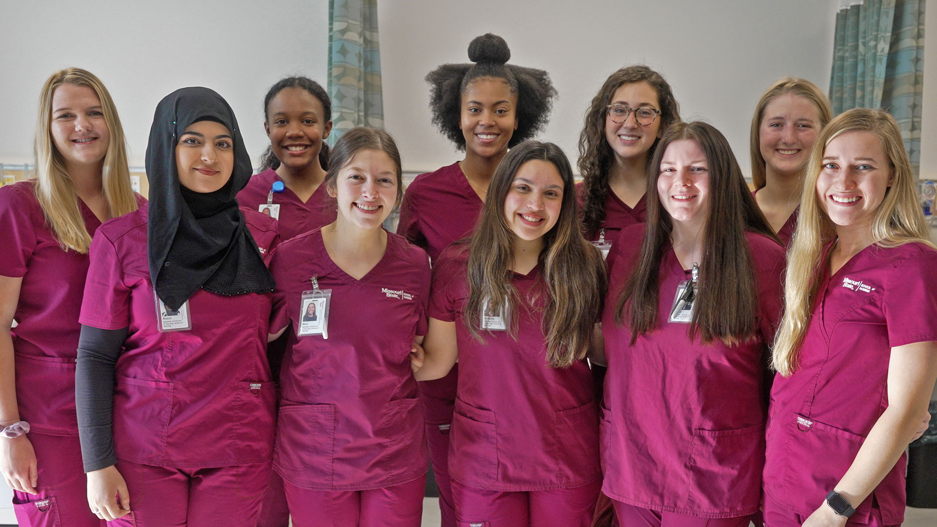 Missouri State nursing students in scrubs standing as a group.