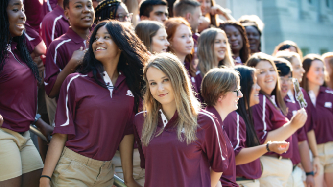 Group of students in maroon shirts
