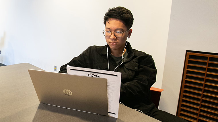 Student using laptop.