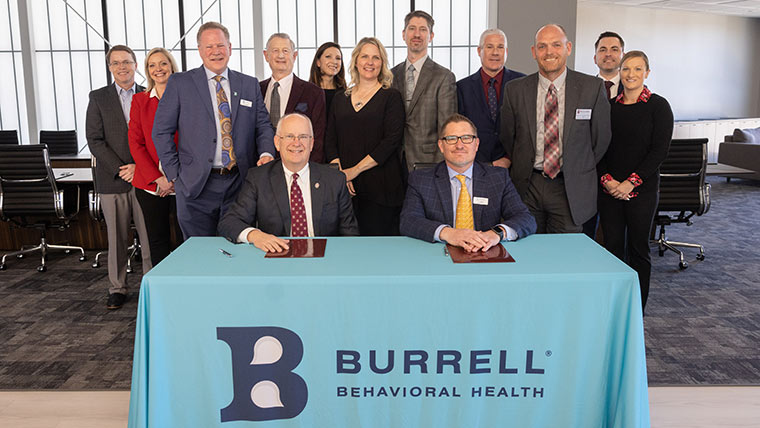 Officials from Missouri State University and Burrell Behavioral Health posing for a group photo during the PsyD program partnership announcement.