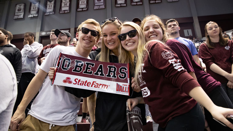 Students represent the Bears at a basketball game.