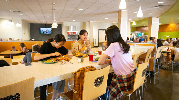 Students gather to eat in dining hall