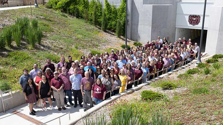 Staff members gather for a large group photo at the newly opened Grand Street Underpass during Staff Appreciation Week.