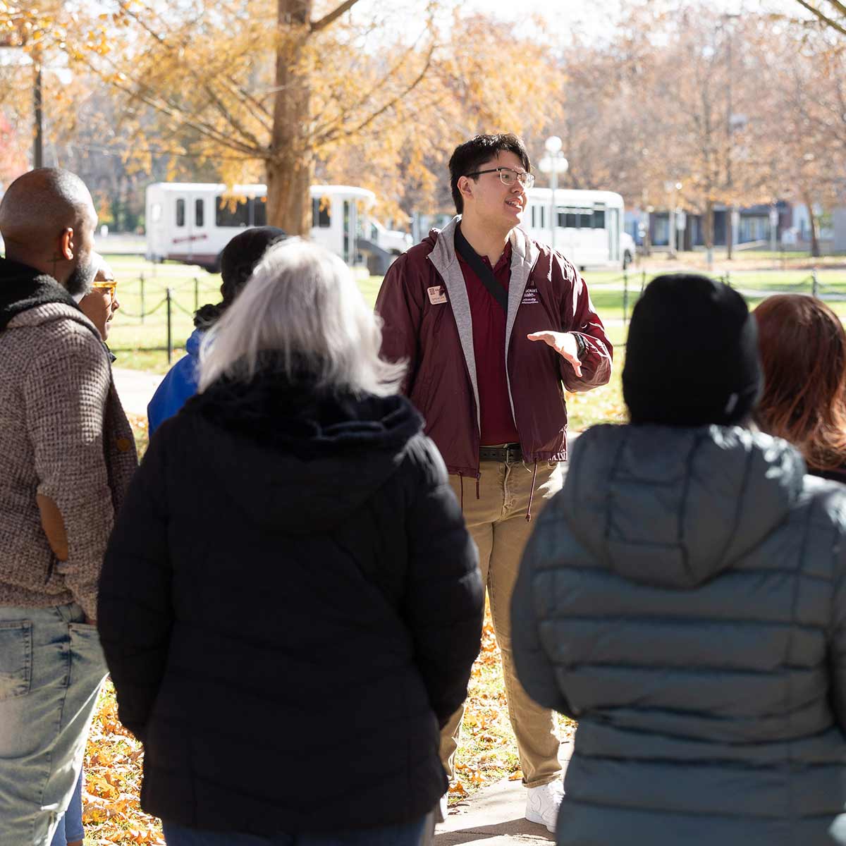 A student tour guide speaking to a tour group during Fall Showcase.