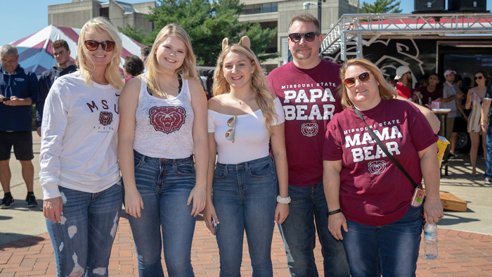 A family poses for a photo in Missouri State shirts