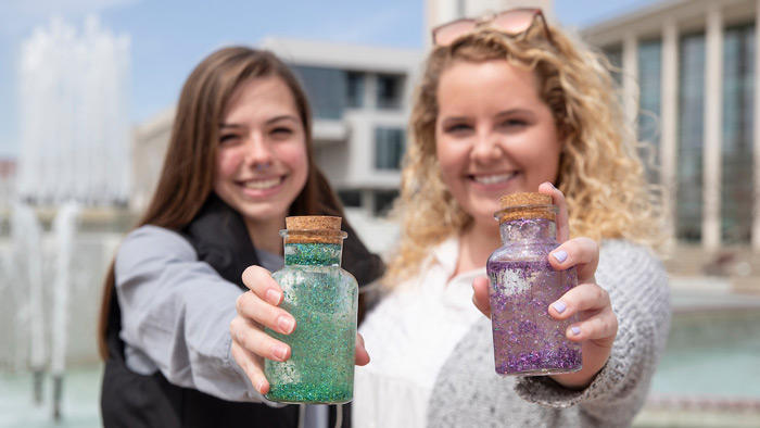 Students display their colorful bottles of fountain water