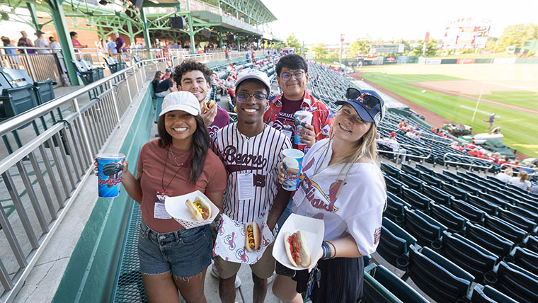 Students enjoying hotdogs at Hammons Field in Springfield