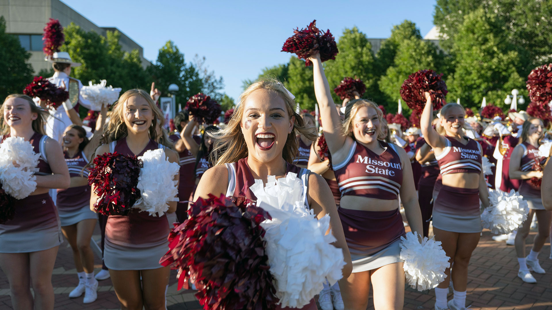 Missouri State University cheerleaders outdoors.