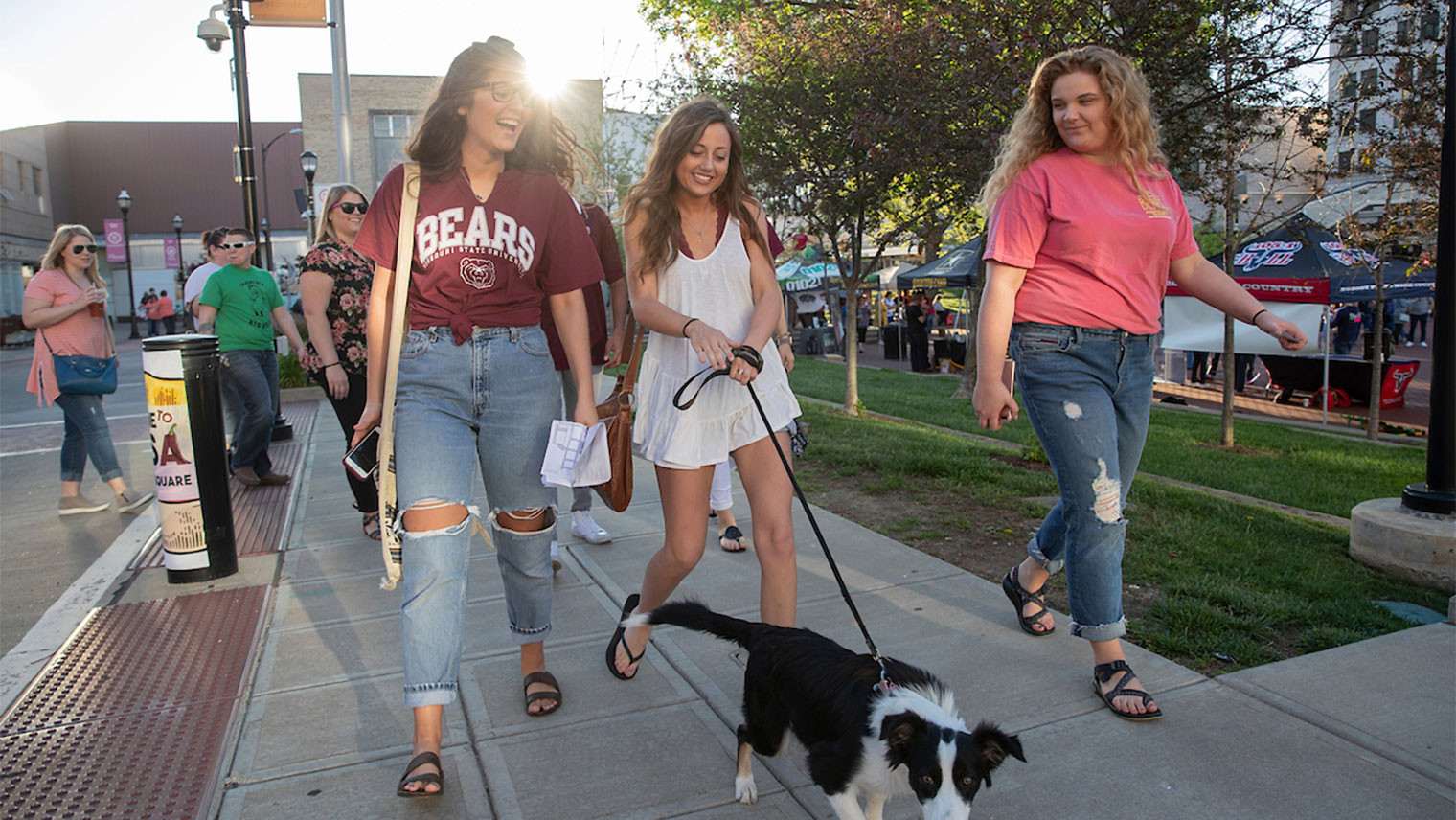 Students walking dog in downtown Springfield