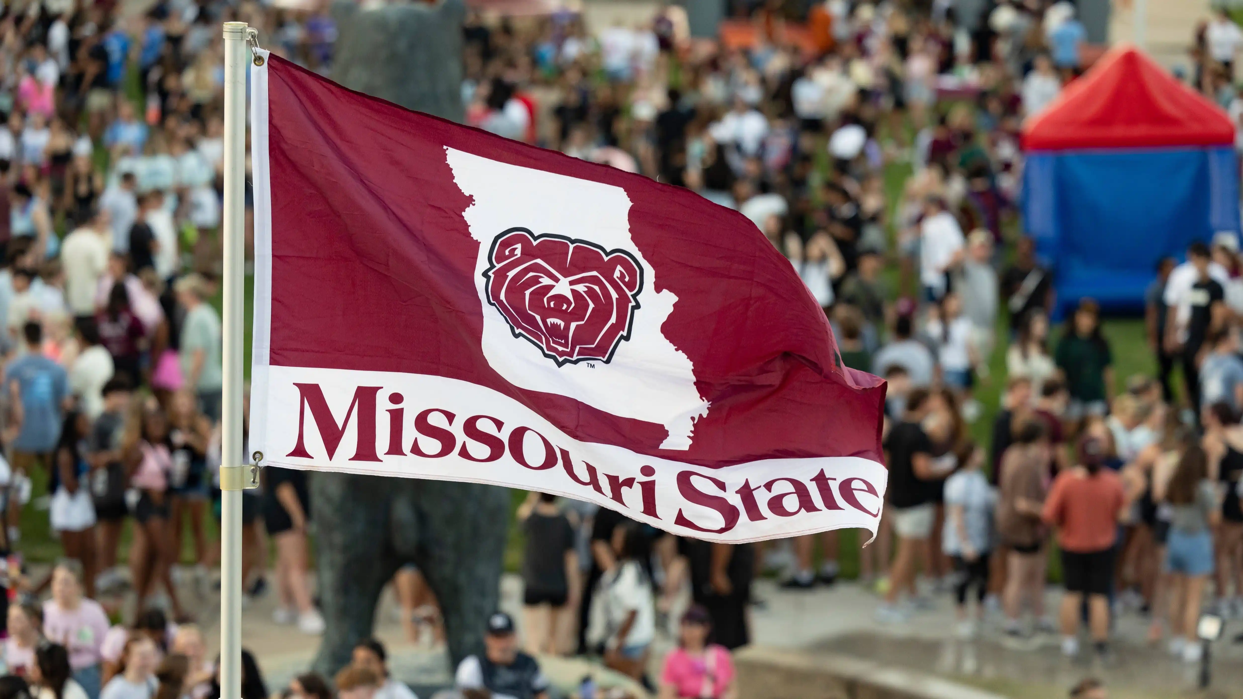 A Missouri State University flag blowing in the wind.