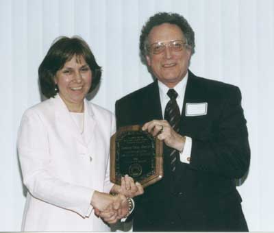 Staff recipient Stephanie Merinec with Dean Lawrence