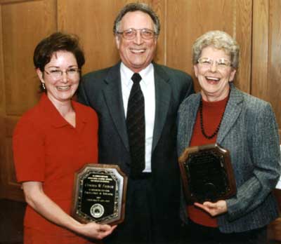 Staff recipient Cindy Fiedler and faculty recipient J.B. Petty with Dean Lawrence