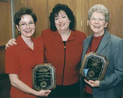 Staff recipient Cindy Fiedler and faculty recipient J.B. Petty with Kathy Davis