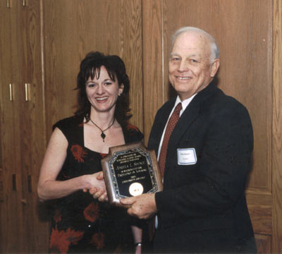 Staff recipient Angela Spence with President Keiser
