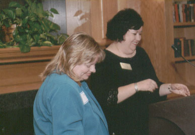 Sandy Culver is recognized by Kathy Davis for her 2005 MACADA Outstanding Advising Award