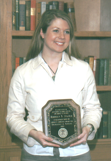 Kimberly Stagner with her award plaque