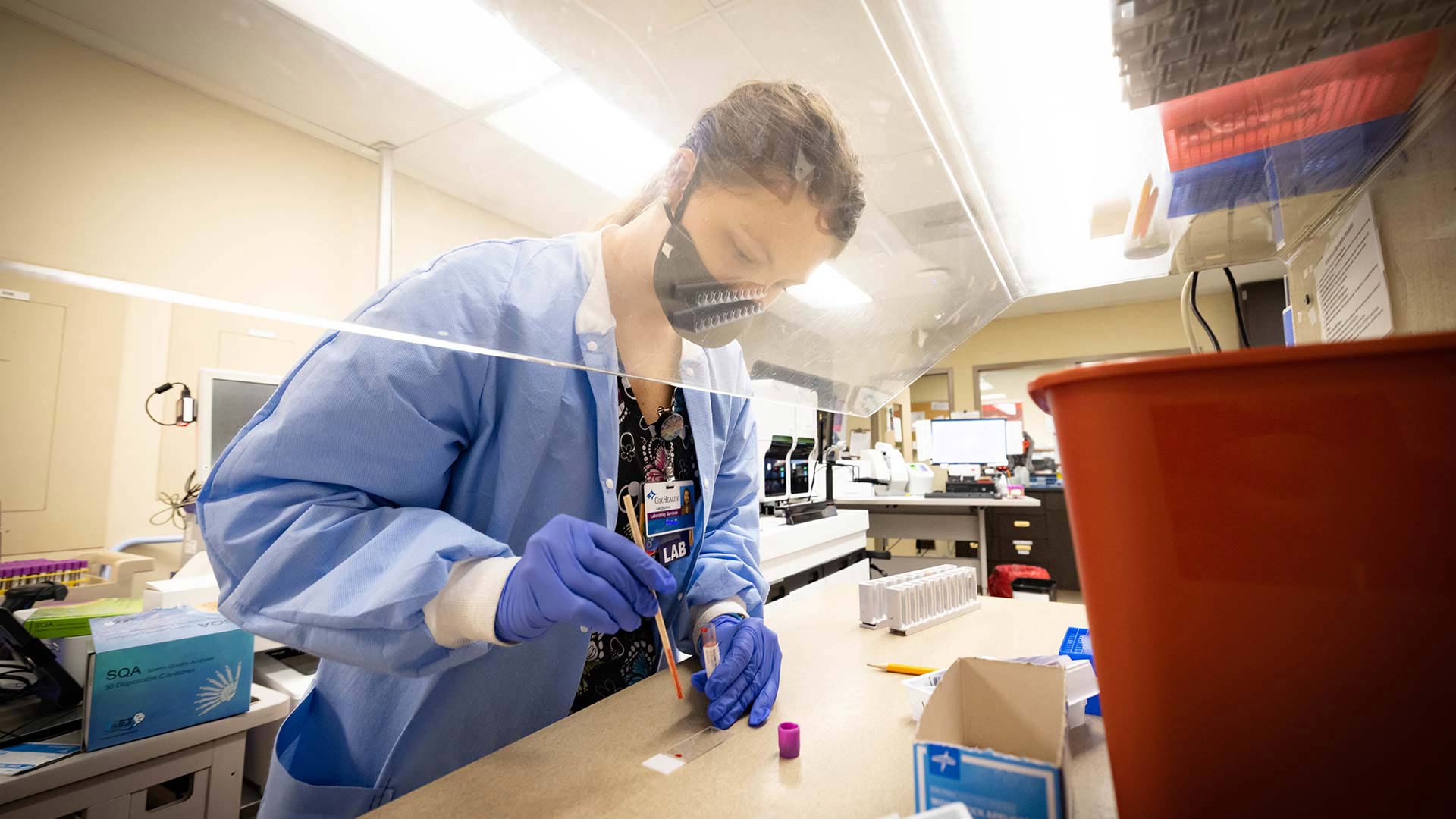 Lab science student testing blood samples.