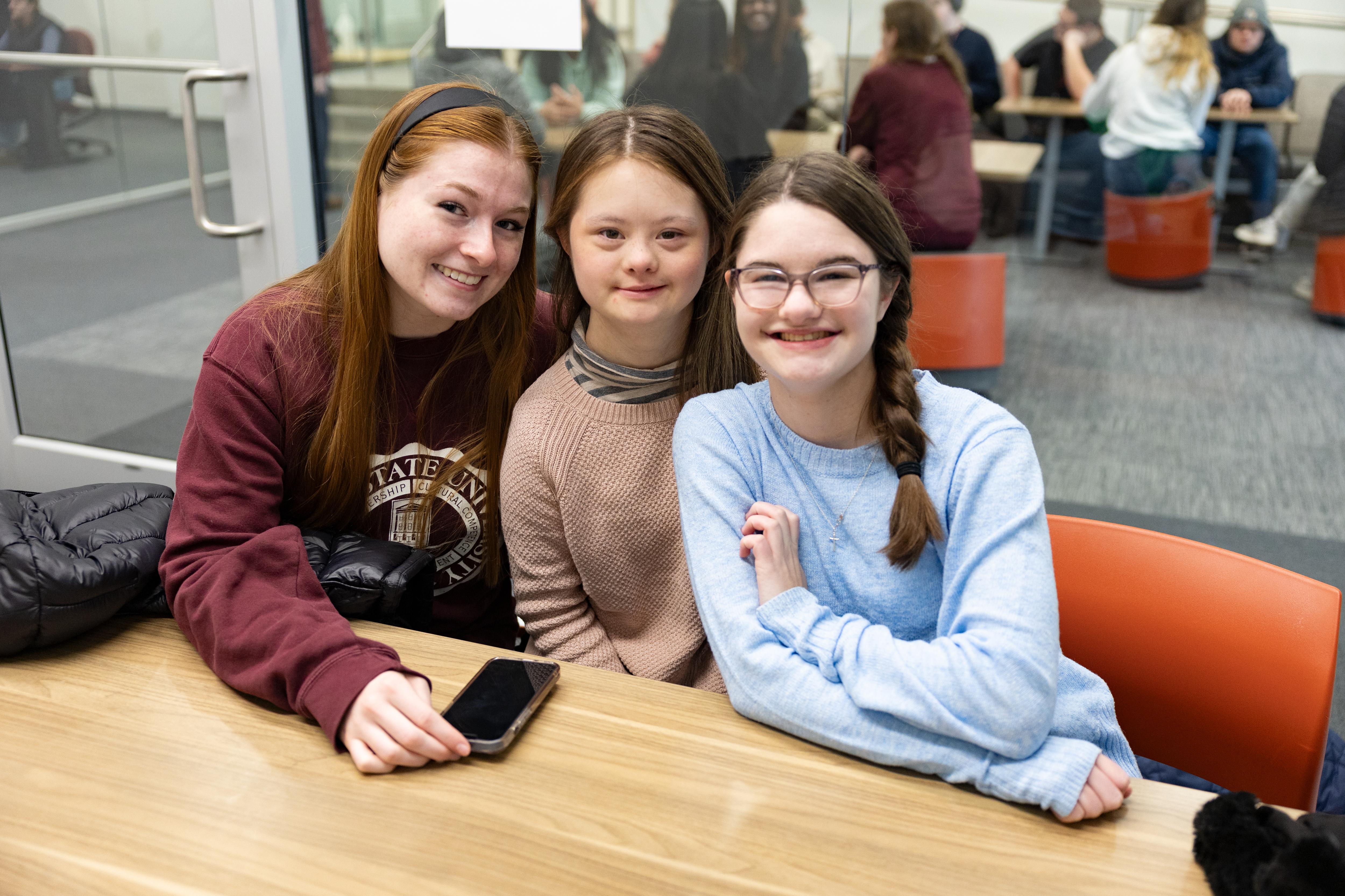 Bear POWER ambassador smiling with Bear POWER students.