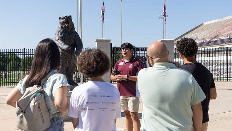 A SOAR leader gives visitors a tour of the Missouri State campus.