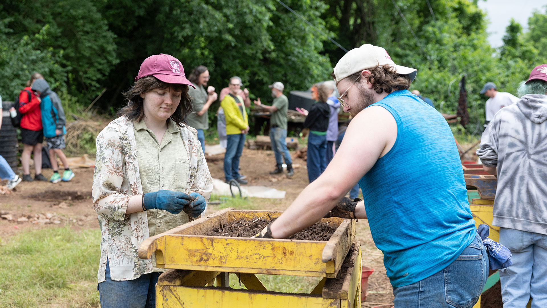 Two students sift for archaeological finds