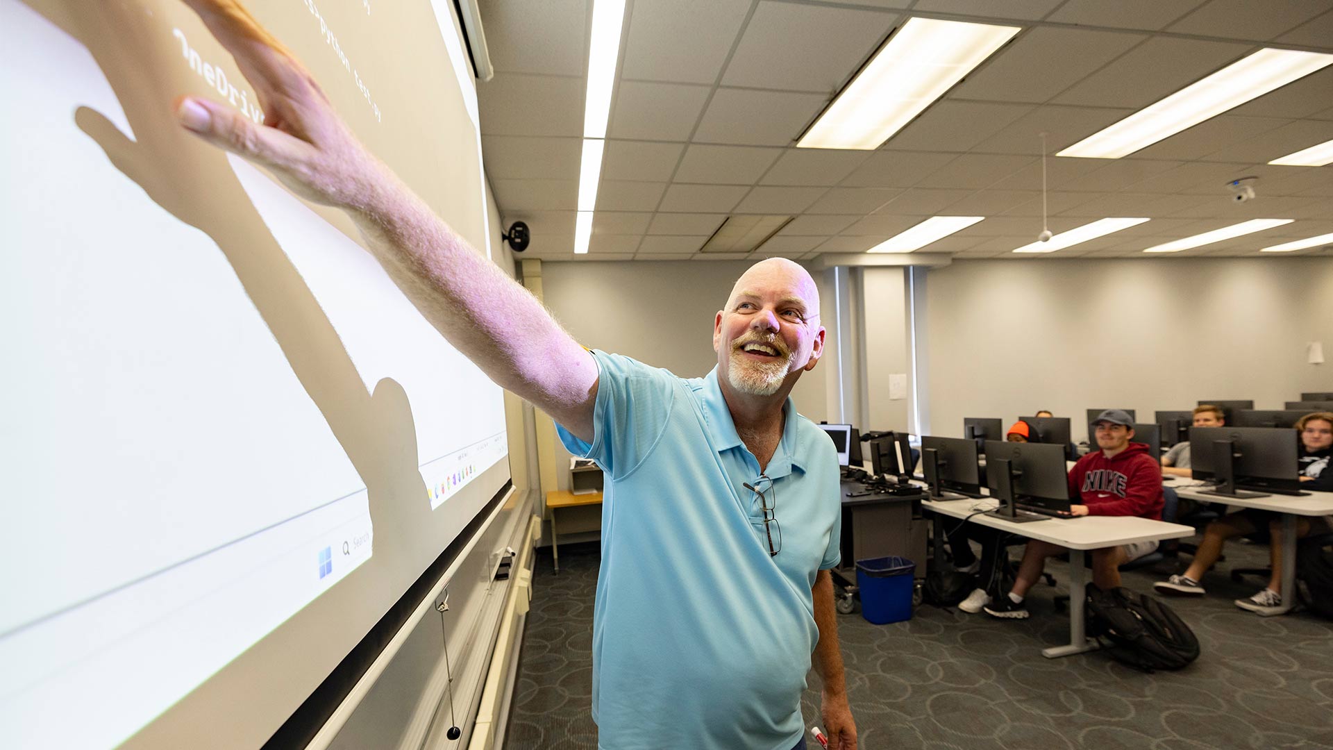 Instructor teaching a computer science class.