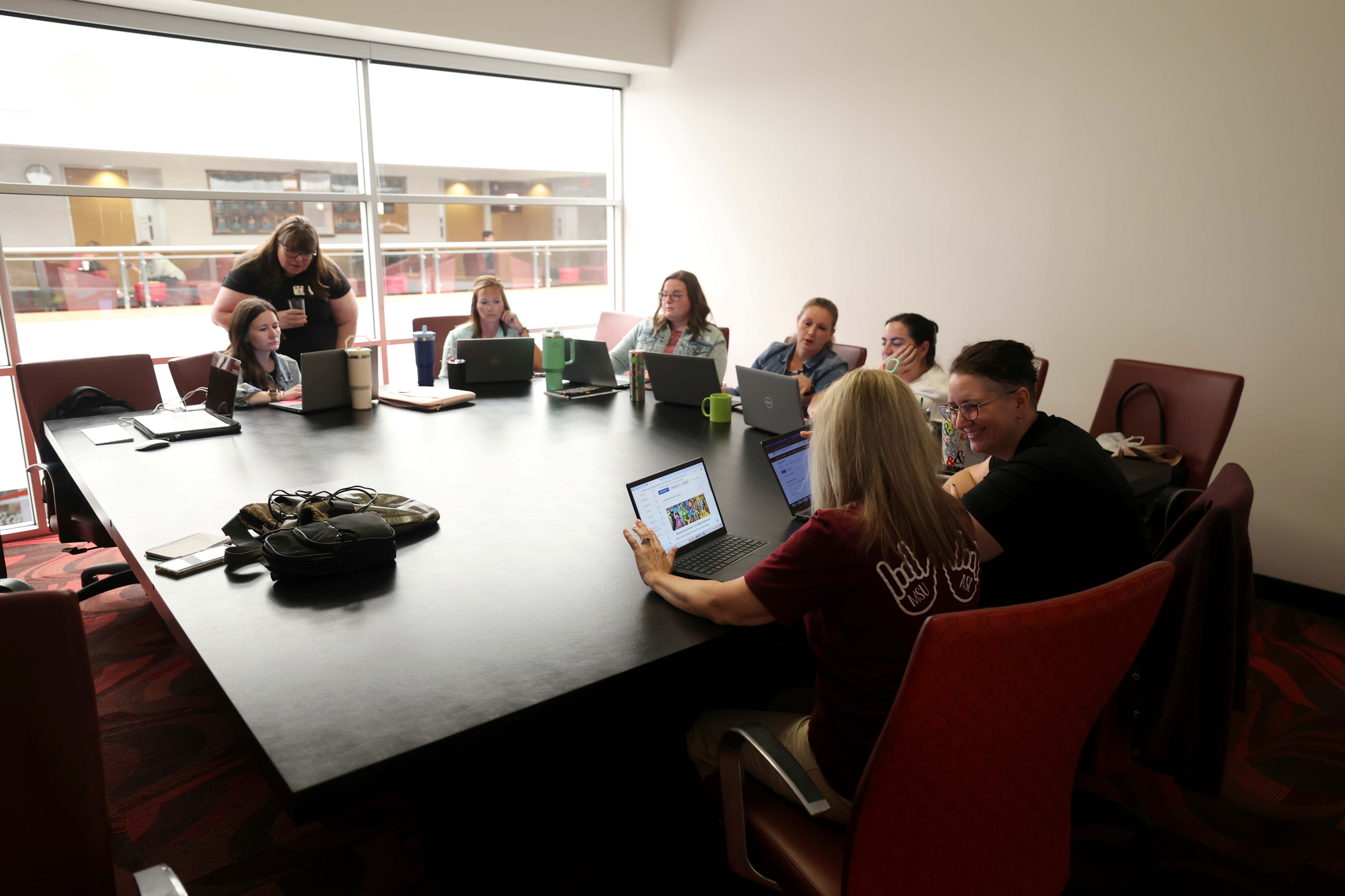 A group of faculty members meet to discuss Brightspace issues