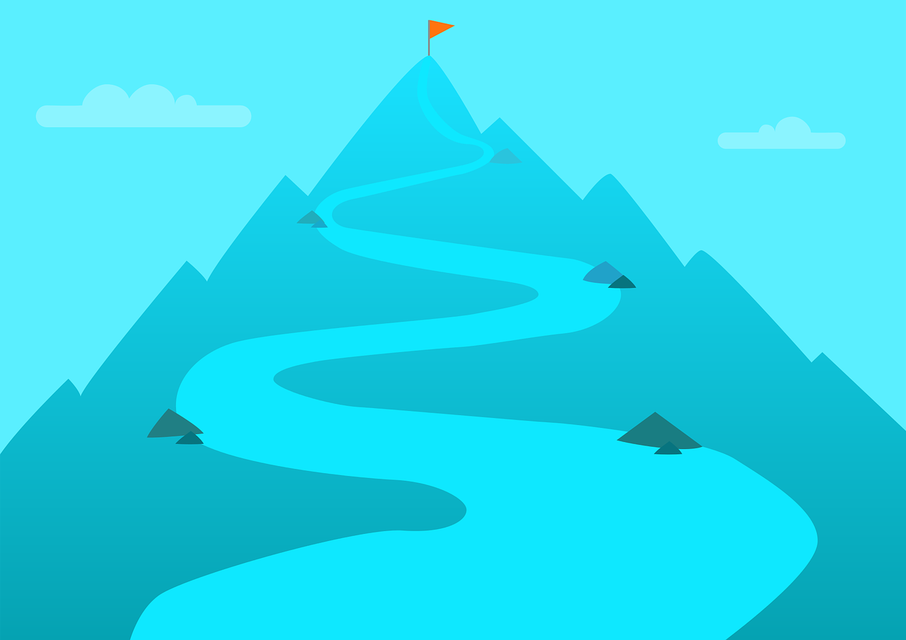 image of a mountain with a path leading to a flag representing reaching a goal