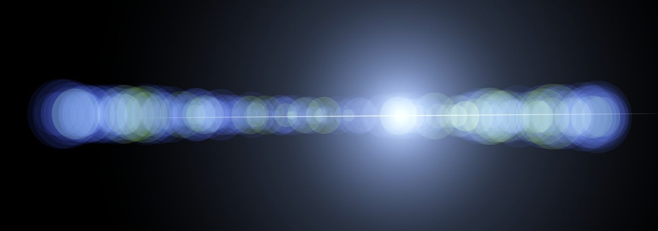 blue background with circles of light running in a line horizontally