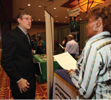 Student talking with interviewer at job fair