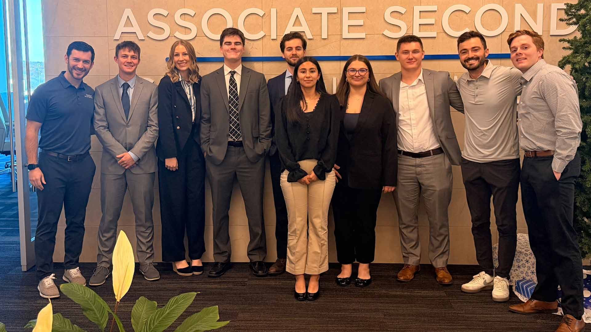 A group of financial planning students met with a financial planning professional in the corporate office of Mariner Wealth Advisors.