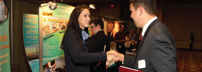 Student shaking hands with interviewer at job fair