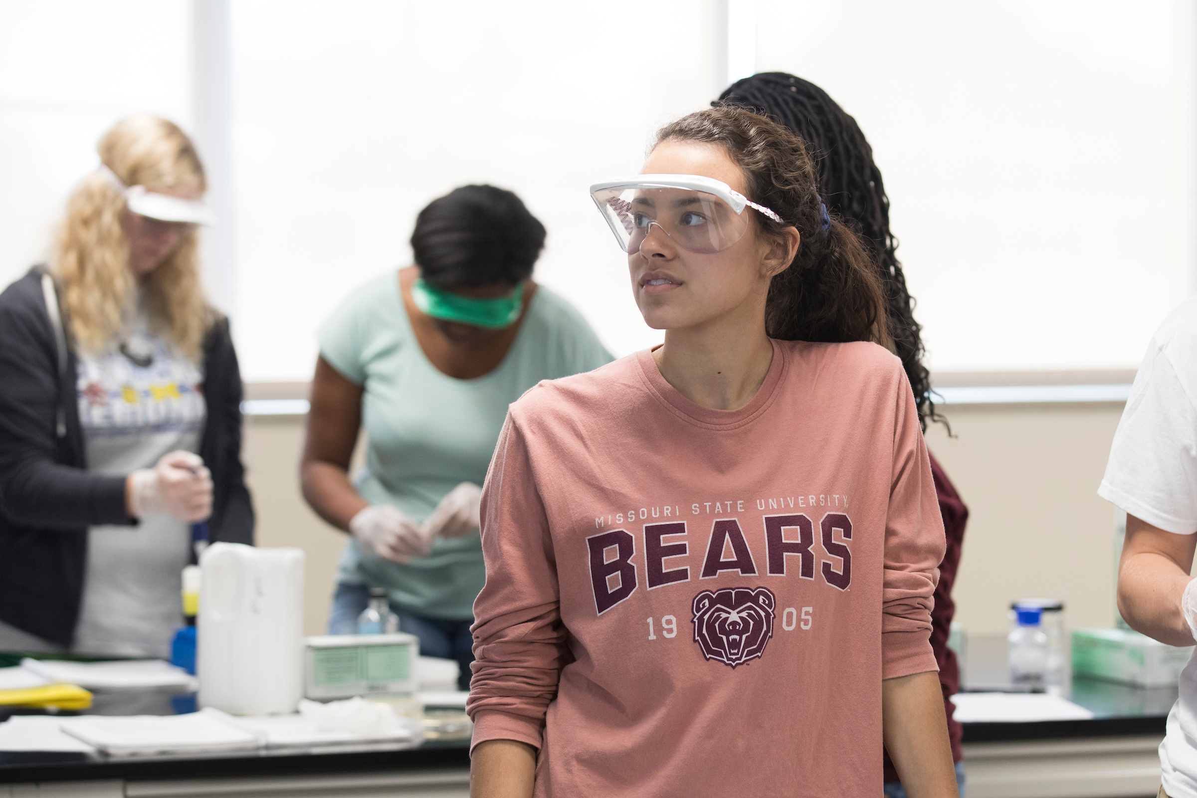 Student wearing protective eyewear in class