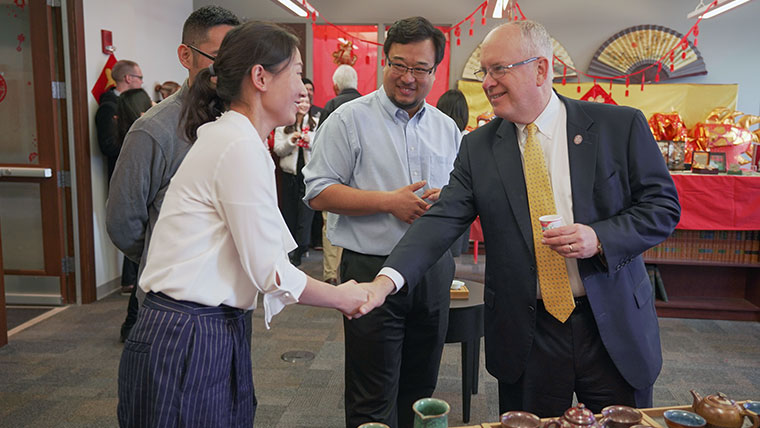 President Smart participating in the Chinese New Year tea ceremony demonstration.
