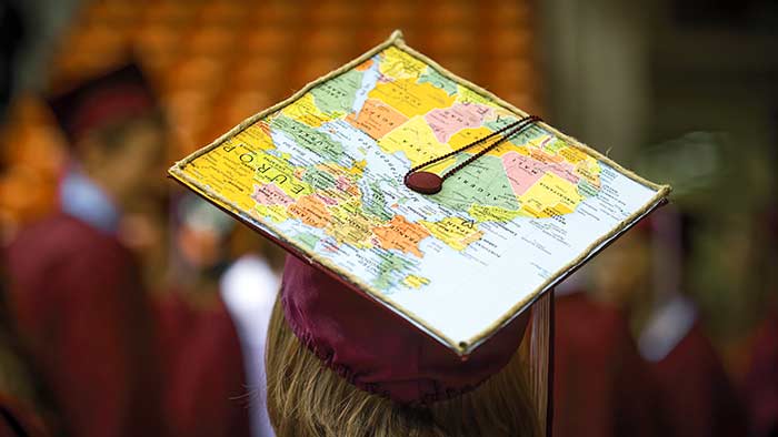 Close up of a graduating student's mortar board decorated with a map