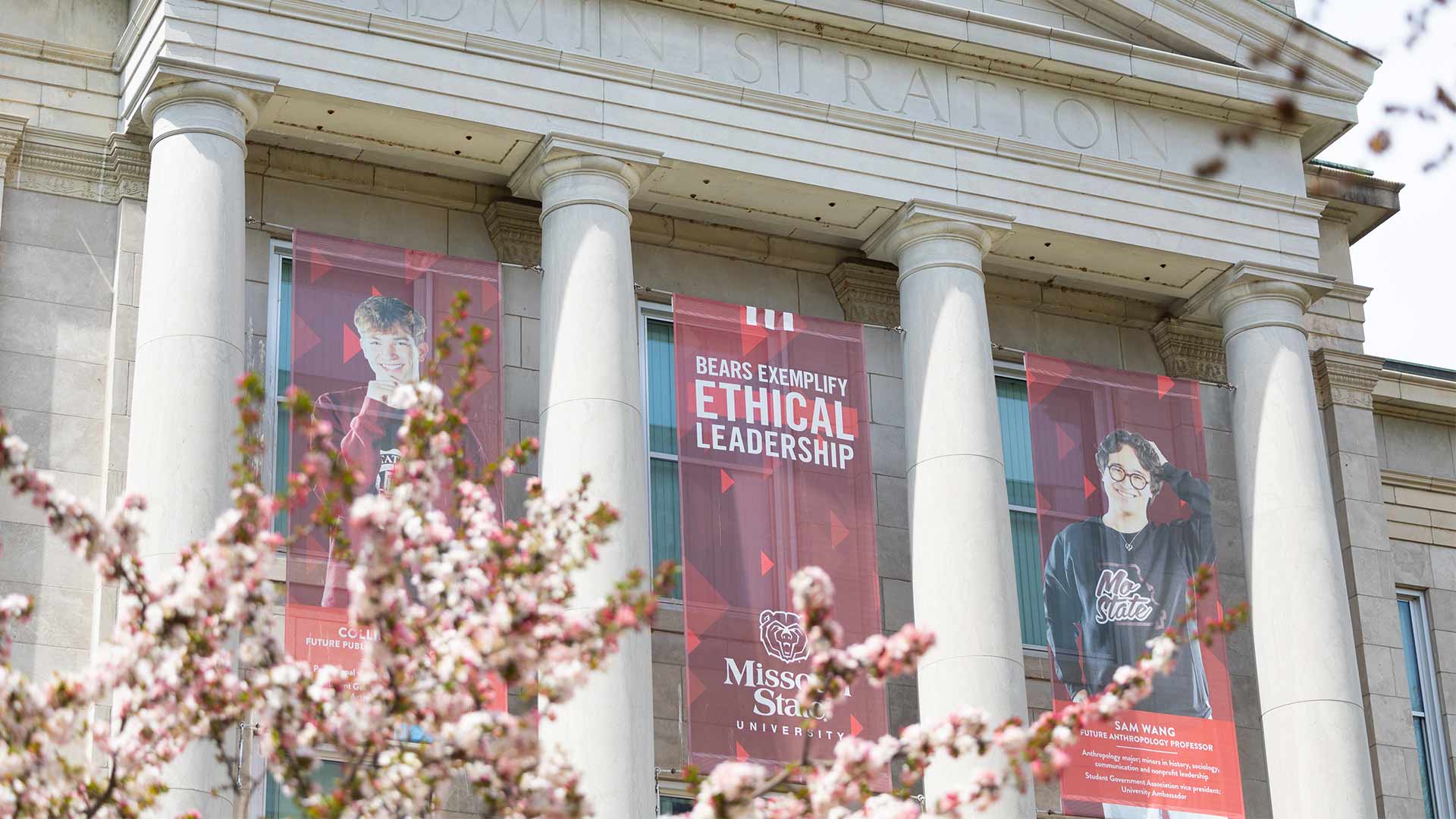 Missouri State building banners hanging in front of Carrington Hall.