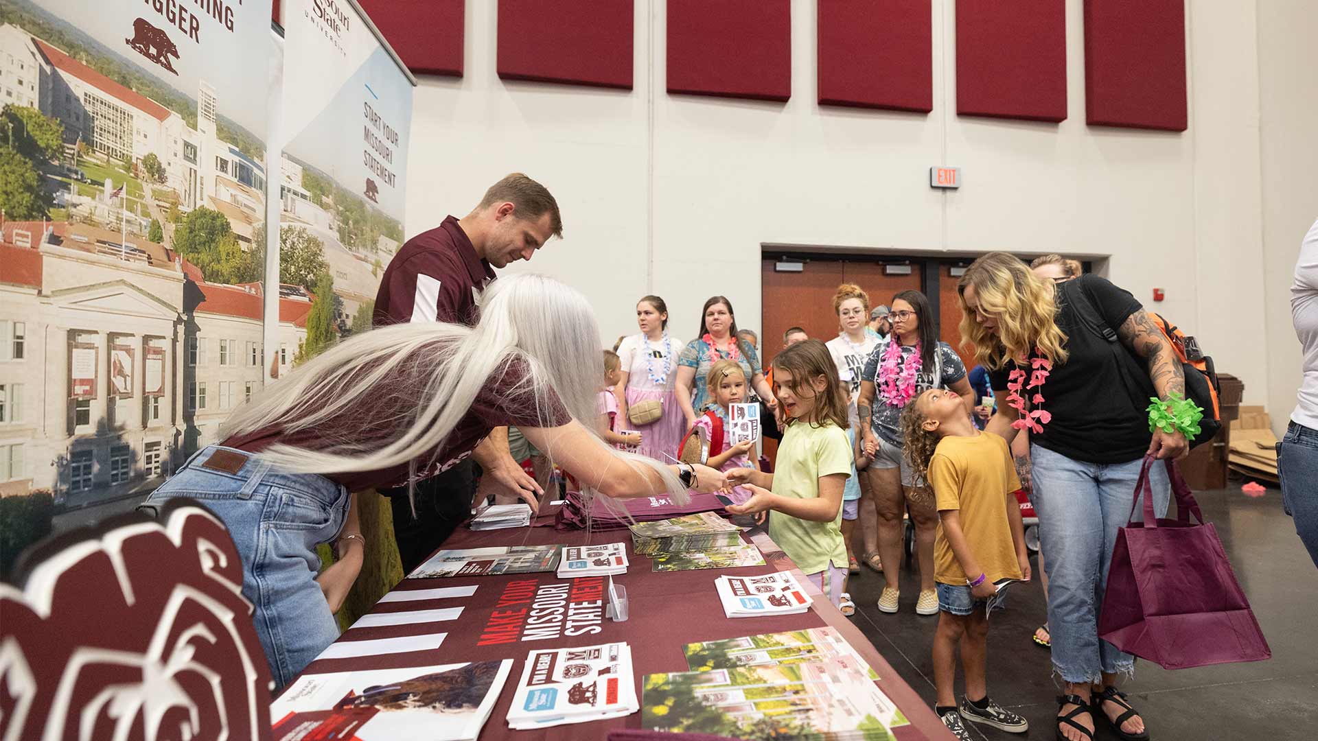 Missouri State representatives handing out pamphlets and brochures to school children at SPS Back to School Bash event.