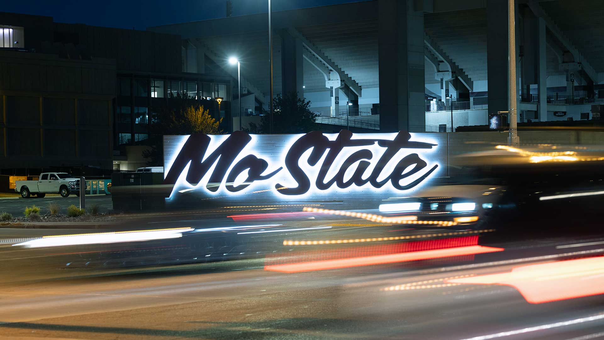 Mo State sign near Plaster Student Stadium as seen at night.