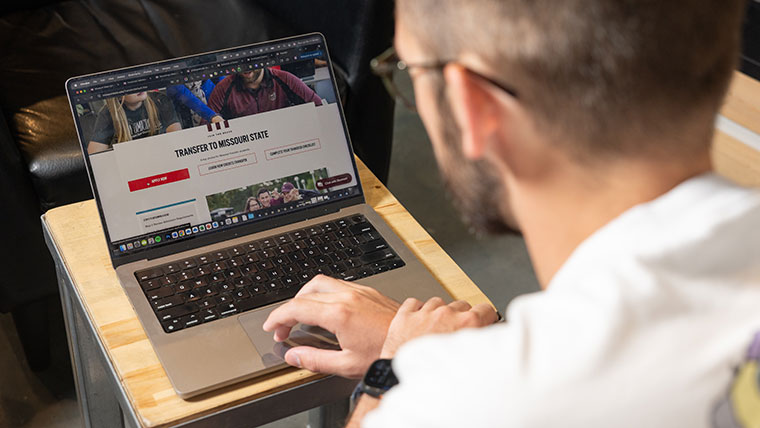 A man views Missouri State's transfer student webpage.