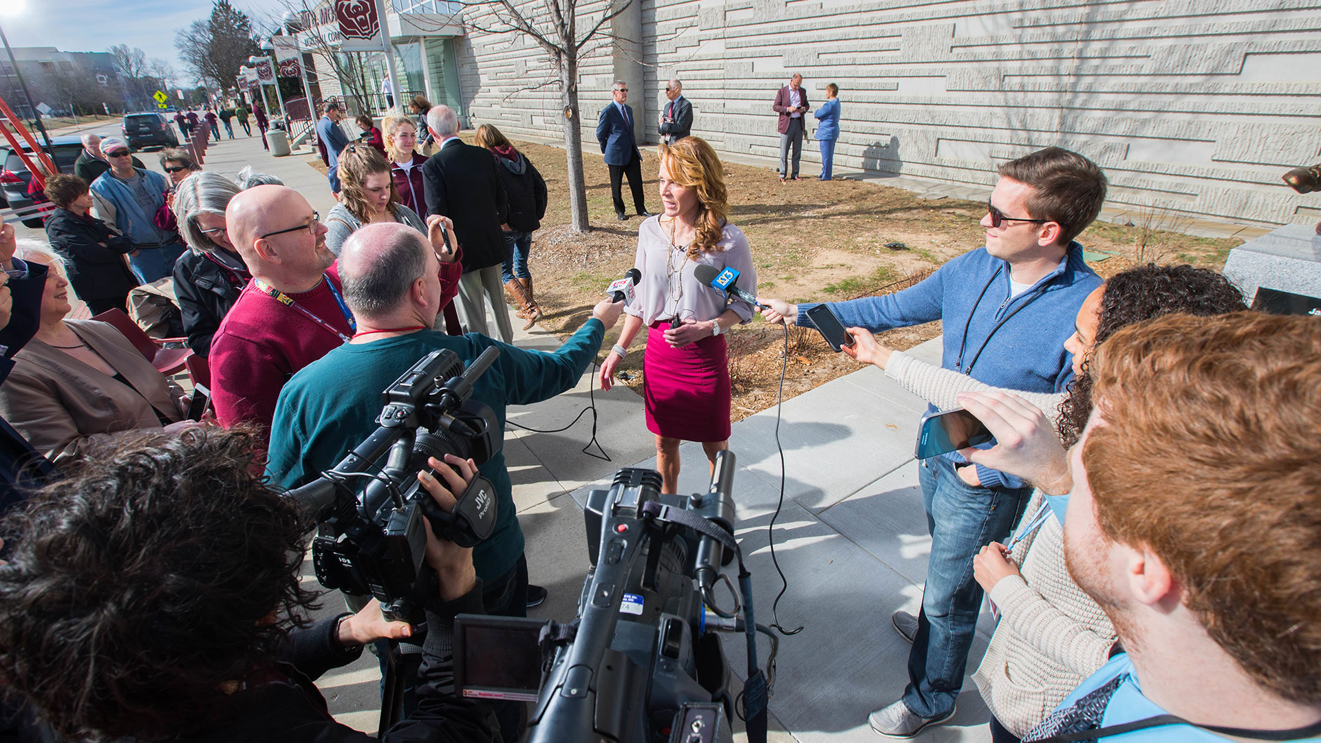 Jack Stiles, an acclaimed basketball coach and MSU alum, responds to reporters' questions during the unveiling of her statue outside of Great Southern Bank Arena.