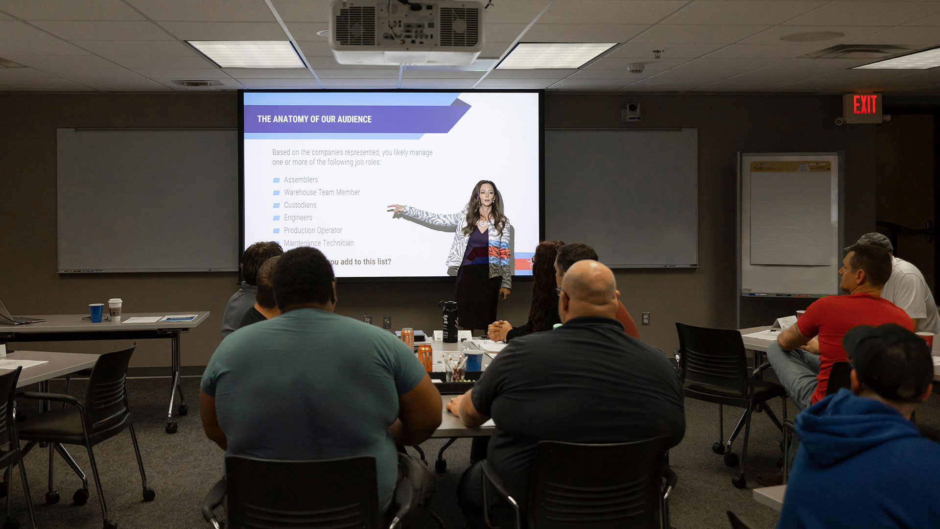 An MSU alumna, Julie Cummings, gives a presentation to a group of individuals at the Small Business Development Center in the eFactory.