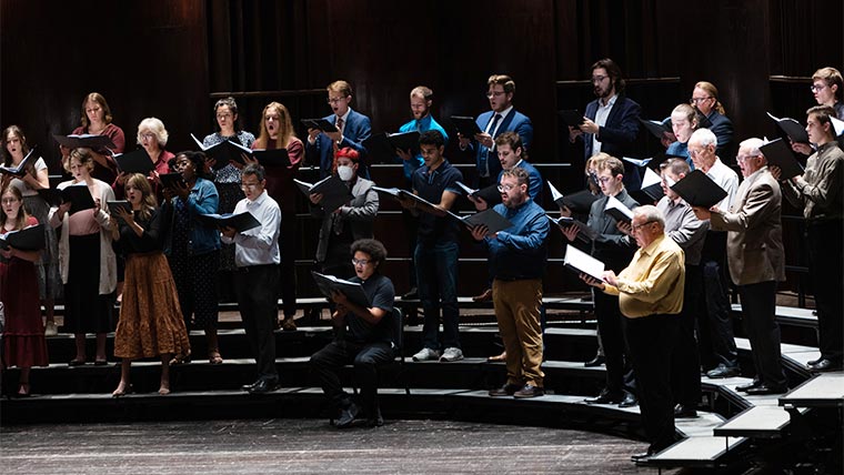 Members of the Choral Union performing in a concert at Plaster Student Union.