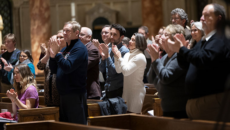Audience giving a standing ovation after a Chorale performance.