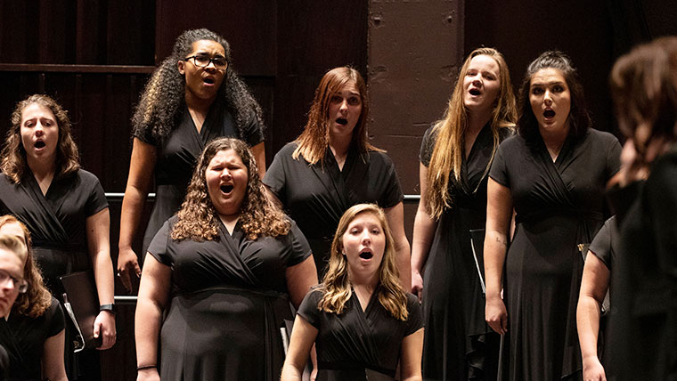 Women's Chorus performing in a concert show.